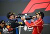 SUZUKA, JAPAN - APRIL 07: Race winner Max Verstappen of the Netherlands and Oracle Red Bull Racing and Third placed Carlos Sainz of Spain and Ferrari celebrate on the podium during the F1 Grand Prix of Japan at Suzuka International Racing Course on April 07, 2024 in Suzuka, Japan. (Photo by Clive Mason/Getty Images) // Getty Images / Red Bull Content Pool // SI202404070309 // Usage for editorial use only //